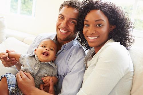Smiling Couple with Baby