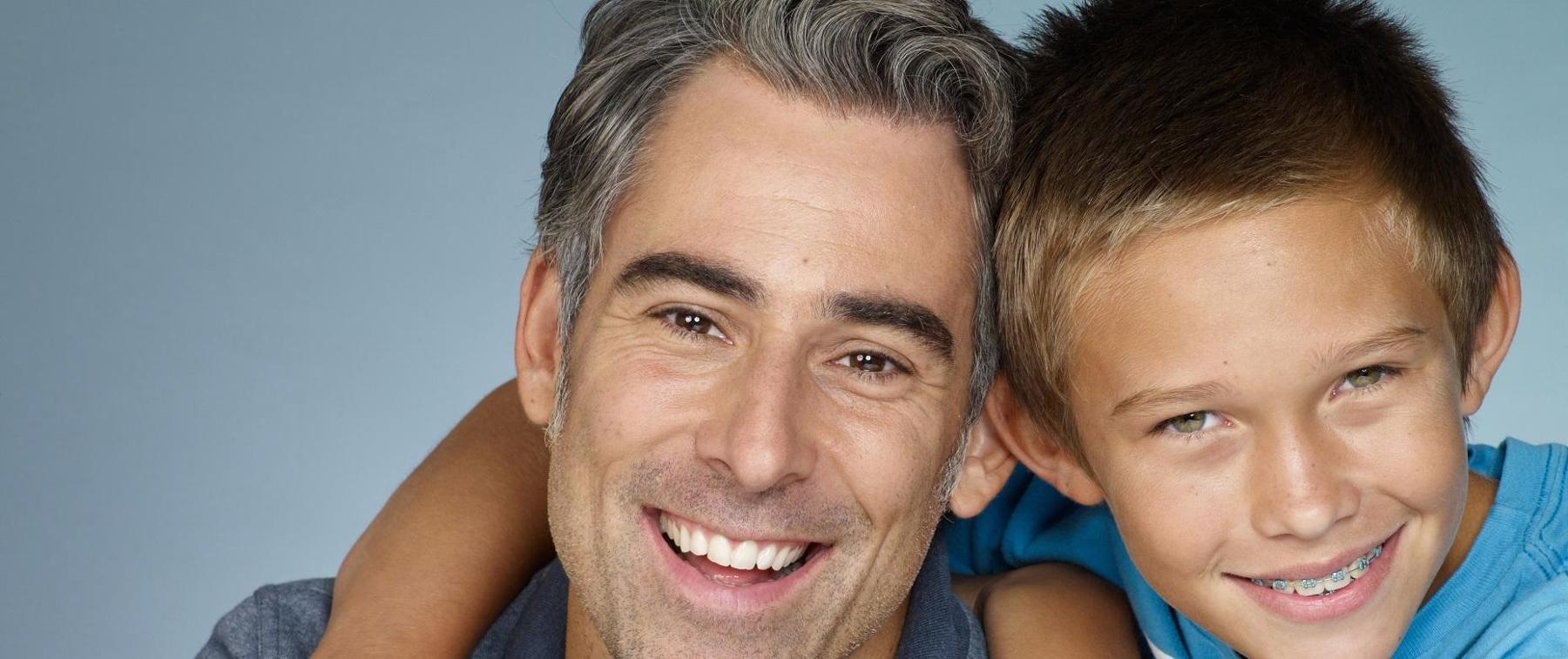 Father and Son smiling in santa monica 