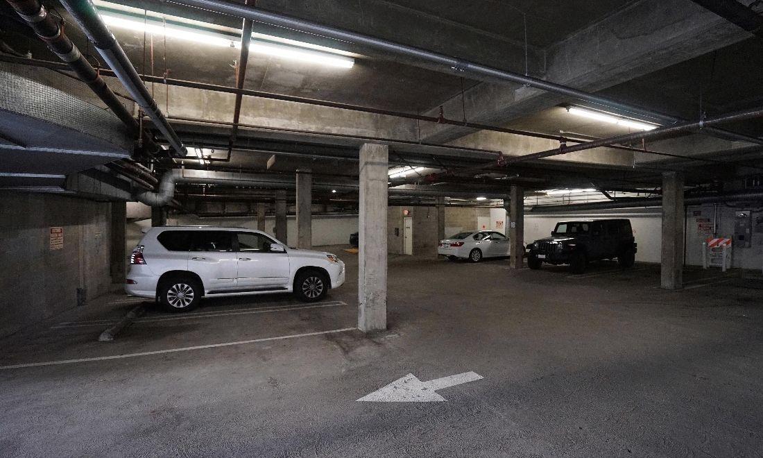 Parking garage with one white car | Vision Dental Montana